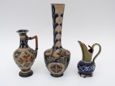 A Doulton Lambeth vase and two ewers, one Royal Doulton,