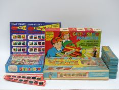 Three Chad Valley Give-a-Show projectors together with various sets of slides,