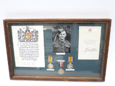WWI Gould brothers medals and ephemera in framed display comprising War medal and 1935 Silver