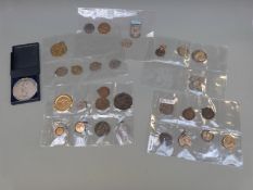 A collection of commemorative coins and medals to include Royal Air Force Athletics Association,