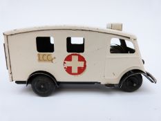 Tri-ang Minic clockwork tinplate London Ambulance with white and black body,