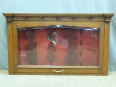 A wall mounted oak four gun glazed display cabinet with bevelled glass and felt lined interior,