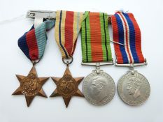 A group of four WWII medals comprising 1939/1945 Star, The Africa Star,