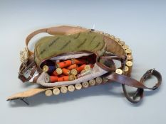 Seventy-five 12 bore/ gauge shotgun cartridges in a belt and cartridge bag.
