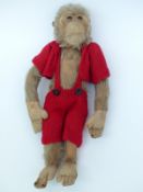 A vintage monkey Teddy bear with blonde mohair, felt hands, feet and face and straw filling,