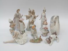 A collection of eleven Lladro and Nao figures