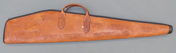 An leather gun/ rifle slip with embossed decoration of an elephant and wool lining, 126cm long.