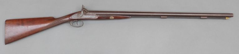 W H Hollywell side by side percussion hammer action shotgun with named and engraved locks,