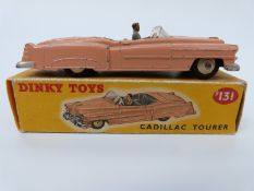 Dinky Toys diecast model Cadillac Tourer with salmon pink body, grey interior,