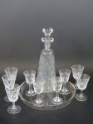 A cut glass liqueur set,