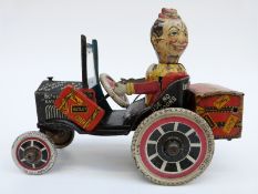 Louis Marx clockwork tinplate Crazy Clown and car with black body, red and yellow travelling chest,