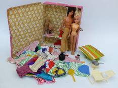 Two Sindy and Barbie dolls together with a large quantity of clothes and accessories in a Mattel