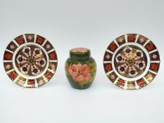 Moorcroft ginger jar in Hibiscus pattern and two Royal Crown Derby Imari 1128 pattern plates