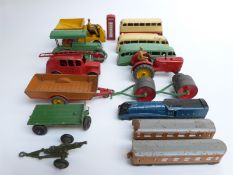 Sixteen Dinky Toys diecast model commercial vehicles including a train and coaches, fire engine,