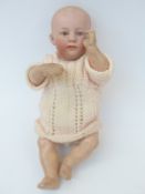 Gerbruder Heubach bisque headed doll with closed mouth painted blue eyes,