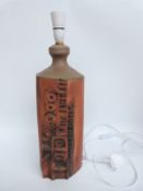 A large Cornish pottery lamp,