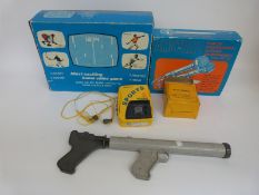 A retro video computer games console together with a Sony Sports Walkman,