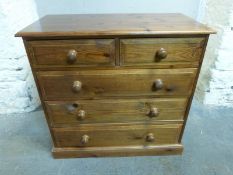A pine chest of two over three drawers, W91.