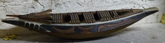 A carved African tribal boat,
