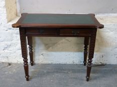 A 19thC style occasional table with two drawers raised on reeded legs W96 x D49 x H 77cm