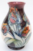 Moorcroft vase of squat form in Red Tulips pattern by Sally Tuffin, 18cm tall,
