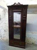 A late 19thC wardrobe with mirrored door and drawer below W90.