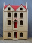 A basic wooden doll's house, 100x63x35cm.