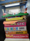 Eight various vintage games including etch-a-sketch, Merit Magic, 65 in 1 Electronic Project Kit,