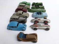 Thirteen Dinky Toys diecast model cars including land speed record cars, saloons,