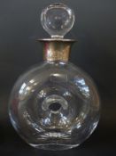 A hallmarked silver collared Broadway glass dougnut decanter (B'ham 2006) 24cm tall.