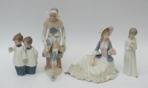 Four Spanish porcelain figures comprising clown, child in nightdress,