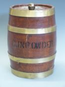 A wooden brass bound gunpowder barrel with metal plaque stamped Gunpowder Grade A 691 Woolwich