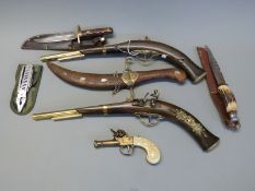 Seven replica pistols and knives including a pair of duelling pistols, antler handled hunting knife,