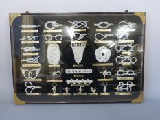 A collection of naval and other knots in brass bound case