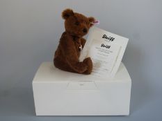 Steiff Teddy Bear The World's First Teddy Bear, with brown mohair, coin pendant and jointed limbs,