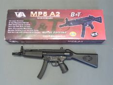 Classic Army MP5 A2 electric airsoft gun MP005M with wide forearm and metal casing, in original box.