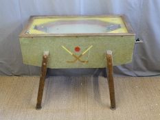 Compton Product coin operated hockey table game with wooden base and glass top, 110x88x64cm.