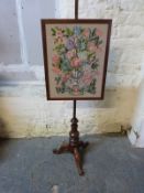 A 19thC pole screen with tapestry panel