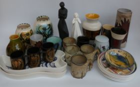 A collection of studio pottery vases, mugs, plates etc including Celtic,