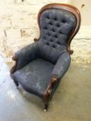 A 19thC show wood framed upholstered armchair