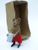 Schuco clockwork tinplate felt covered mouse lifting a mug stamped 'Schuco Patent' and 'Made in