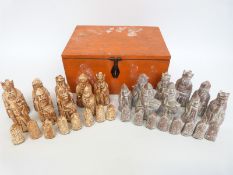 A Lewis Chessmen chess set in wooden box, height of king 8.8cm.