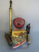 A fire bell, brass sprayer, two fire extinguishers, copies of Practical Mechanics, wooden train,