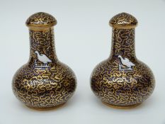 A pair of early 19thC Spode covered enamelled vases with hand decoration of an armorial/crest of a