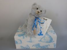 Steiff Teddy Bear Ice with light blue mohair, growler, shaved snout, blue ribbon and jointed limbs,