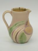 A studio pottery jug signed Susie Cooper to base,