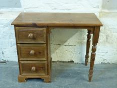 A pine desk with three drawers to one side W91 x D44.