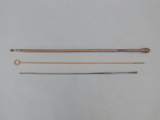 Two gun cleaning rods together with a metal ram-rod, 75cm long.