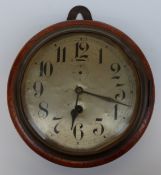 A Junghans ship's bulkhead clock in turned wood case,