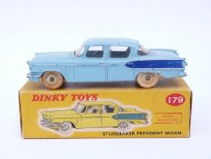 Dinky Toys diecast model Studebaker President Sedan with light blue body, dark blue flash,